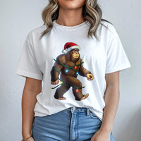 Humorous Sasquatch Santa Hat Shirt, Bigfoot Christmas T-Shirt, Retro Bigfoot Holiday Lights Tee, Adorable Bigfoot Xmas Shirt, Sasquatch Present Tee