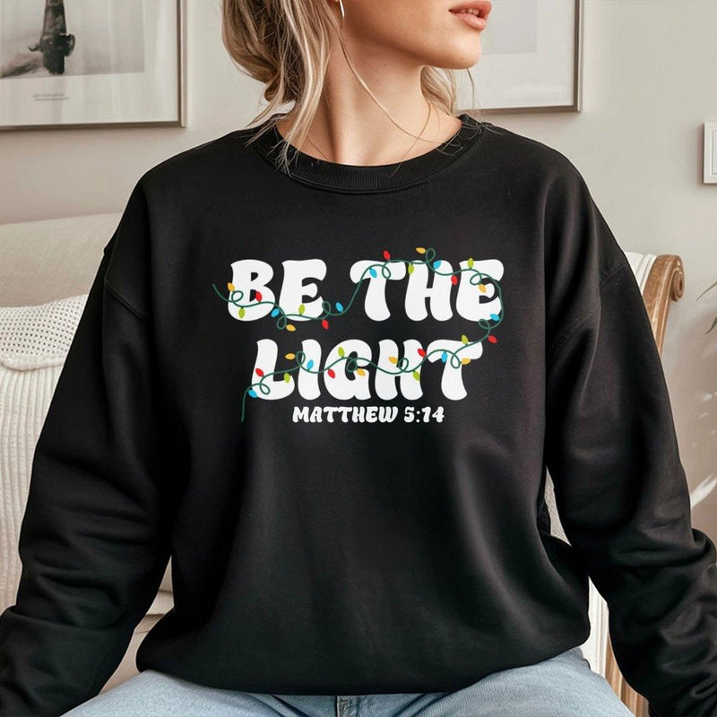 Christian Christmas Sweatshirt, Be the Light Sweatshirt, Faith Bible Verse Holiday Sweater, Religious Christmas Crewneck Sweatshirt