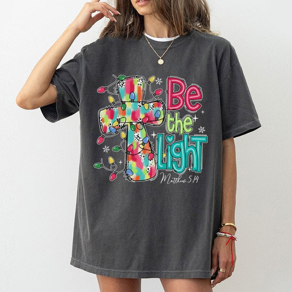 Christmas Cross T-Shirt, Be the Light Christian Shirt, Faith Inspired Holiday Tee, Bible Verse Graphic Shirt, Xmas Present fo