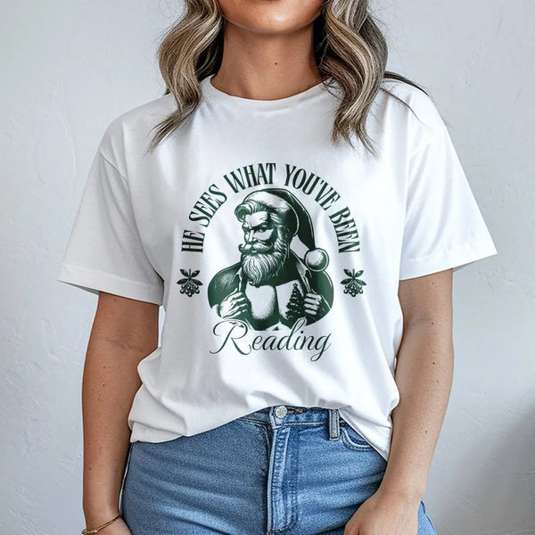 Humorous Santa Book Lover T-Shirt, He Sees What You've Been Reading T-Shirt, Bookish Christmas Shirt, Holiday Reader Graphic 