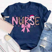 Nurse Christmas Shirt, School Nurse Santa Hat Pink Bow Shirt, Festive Holiday Medical Tee, Adorable Coquette Nurse Graphic Shirt