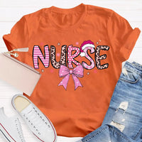 Nurse Christmas Shirt, School Nurse Santa Hat Pink Bow Shirt, Festive Holiday Medical Tee, Adorable Coquette Nurse Graphic Shirt