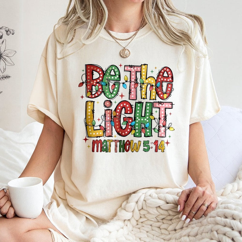Christian Christmas Lights Graphic Shirt, Be the Light Matthew 5:14 T-Shirt, Faith Scripture Tee, Holiday Bible Verse T-Shirt for Women