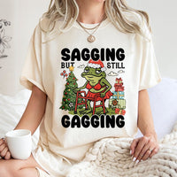 Humorous Frog Christmas Tee, Sagging but Still Gagging T-Shirt, Sarcastic Adult Humor Shirt, Adorable Holiday Frog Graphic Tee, Xmas Frog T-Shirt