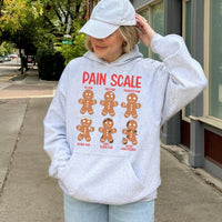 Humorous Christmas Nurse Hooded Sweatshirt, Pain Scale Gingerbread Nurse Hoodie, Holiday Healthcare Worker Sweater, Xmas Nurse Present