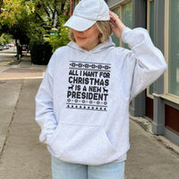 Humorous Political Ugly Sweater Hoodie, All I Want for Christmas Is a New President Hoodie, Retro Holiday Sweatshirt, Activist Graphic Hoodie