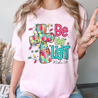 Christmas Cross T-Shirt, Be the Light Christian Shirt, Faith Inspired Holiday Tee, Bible Verse Graphic Shirt, Xmas Present for Women and Men